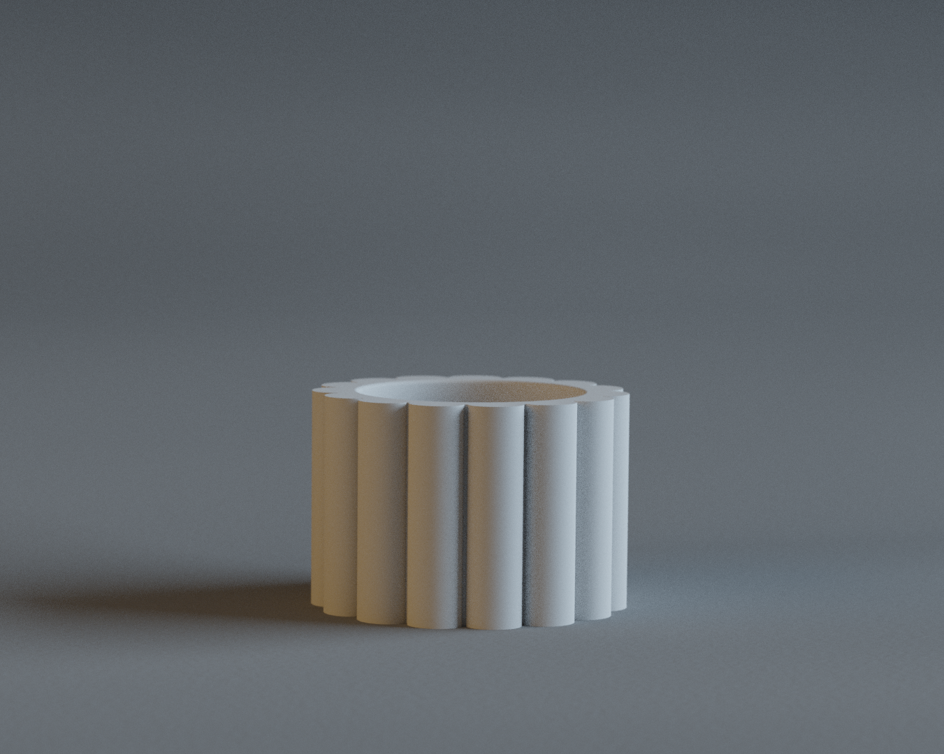 Cylindrical ceramic object with ribbed texture on a gray background